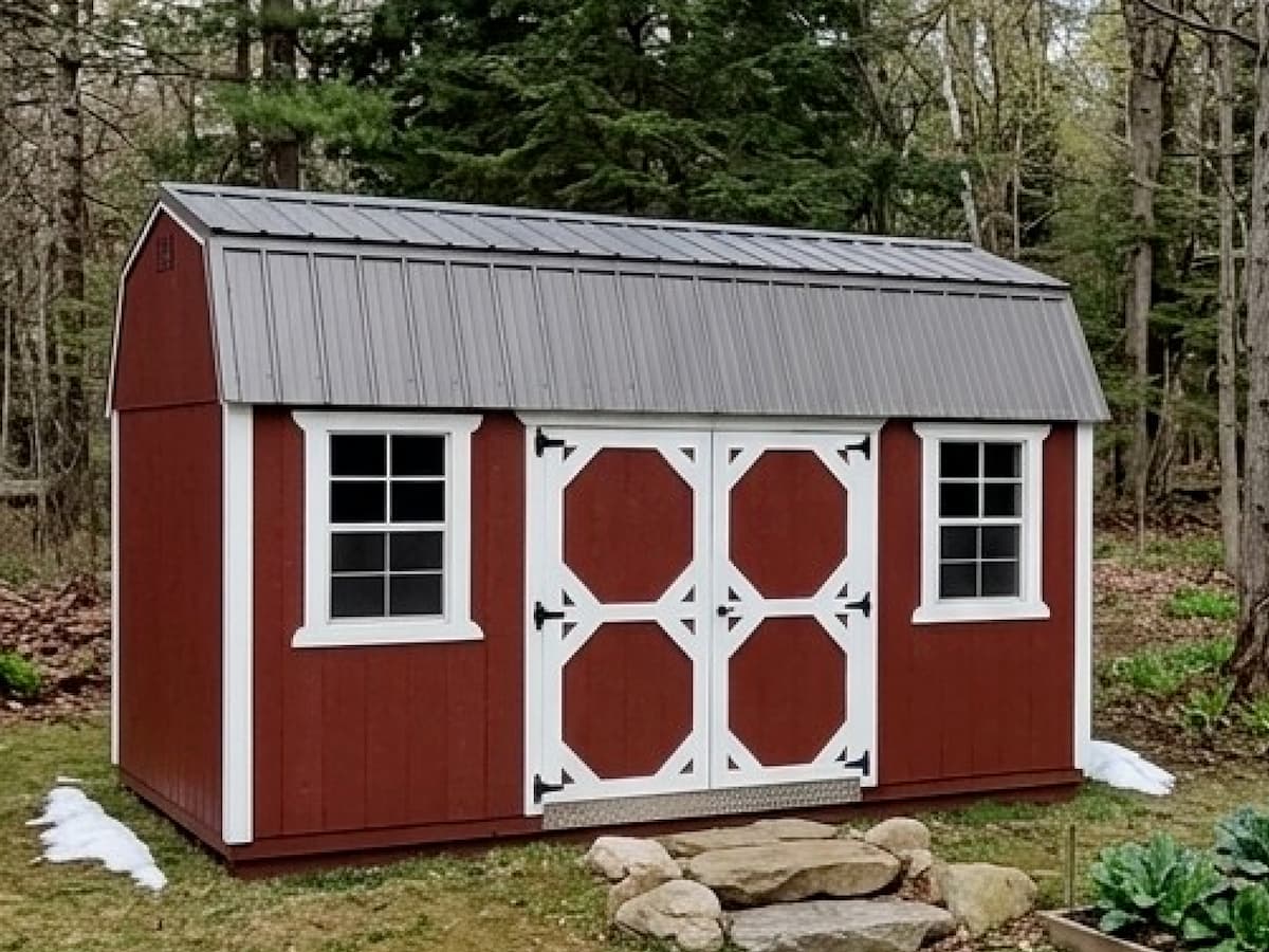 Red Lofted Barn with white trim, windows, and octagon-pattern double barn doors
