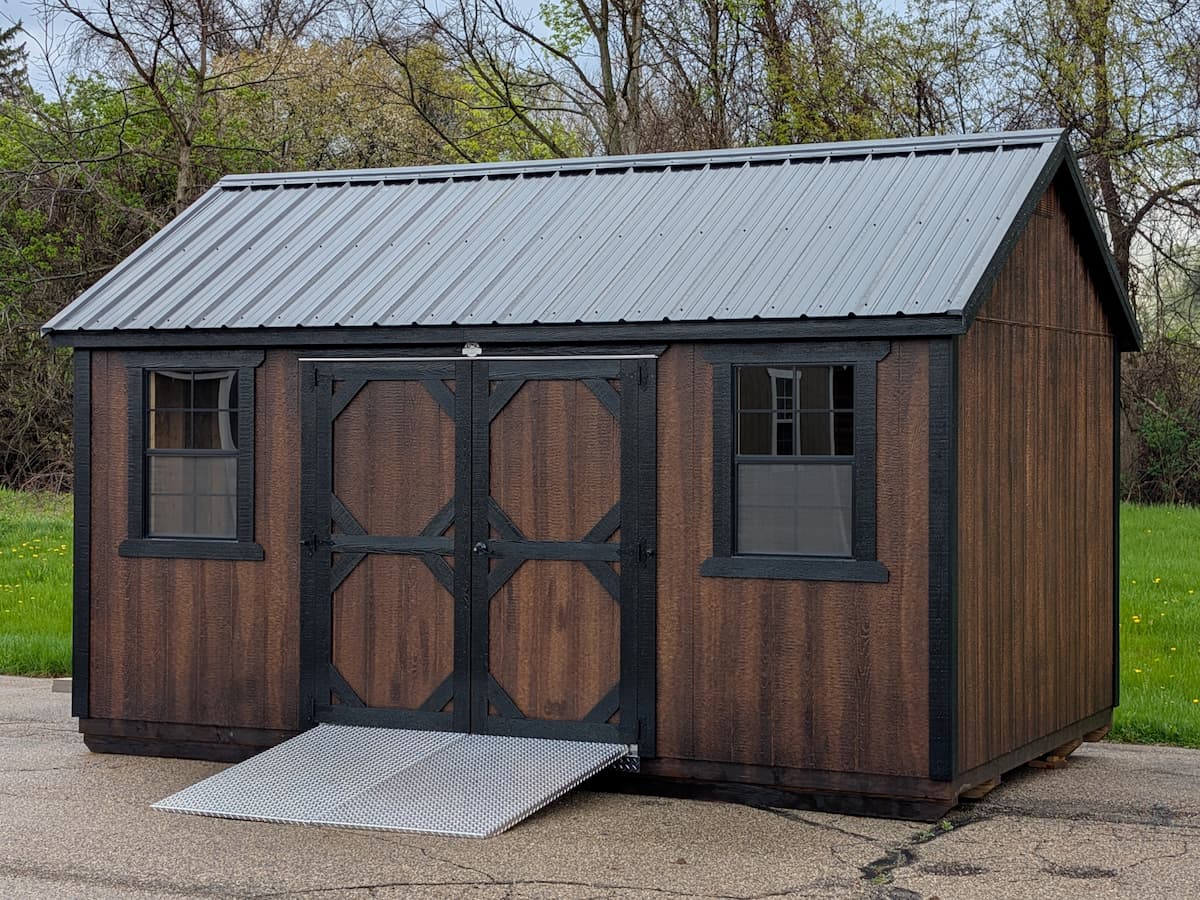 Dark stained Garden Shed with black trim and aluminum ramp