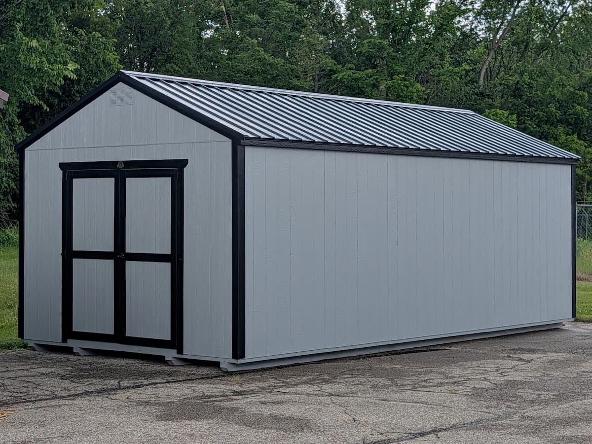 Light gray Classic shed with black trim and black metal roof